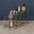 A stylish set of maison jansen faux bamboo nesting tables, featuring brass frames with clear glass tops and lower tiers....