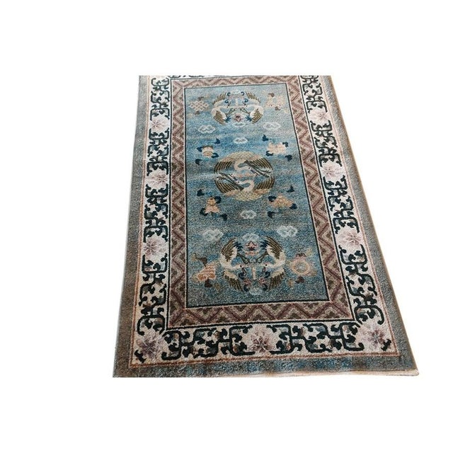 Vintage Silk Small Scatter Size Silk Rug, Circa Date: 1980s. This exquisite piece, woven entirely of lustrous silk, offers...