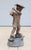Celebrate the timeless charm of golf with this impressive vintage life-size boy golfer garden statue. Crafted from durable...