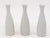 Each single white ceramic vase, crafted in early 21st century France, is part of a set of three, with multiple sets...
