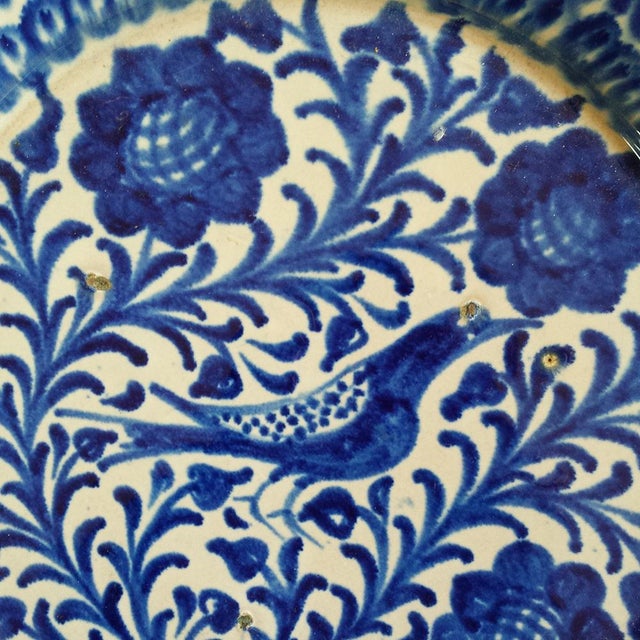 19th c. Spanish Fajalauza pottery plate/bowl with blue hand painted bird and foliage. Fajalauza ceramics come from a...