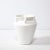This elegant modernist urn form vase was realized in the United States during the latter half of the 20th century. It...