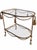 A fantastic Hollywood Regency Italian gilt rope and tassel bar or tea cart. Featuring distinctive twisted metal forged...