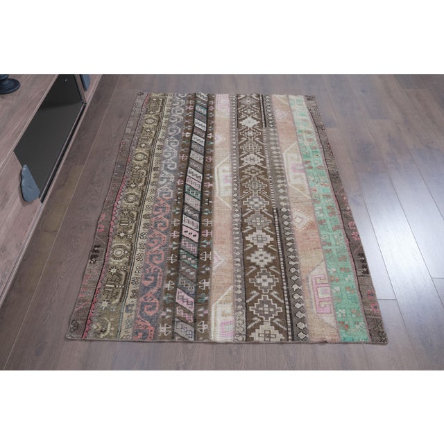 Bring a grounded, mid-century charm to your space with this authentic Anatolian patchwork rug. Carefully assembled from...