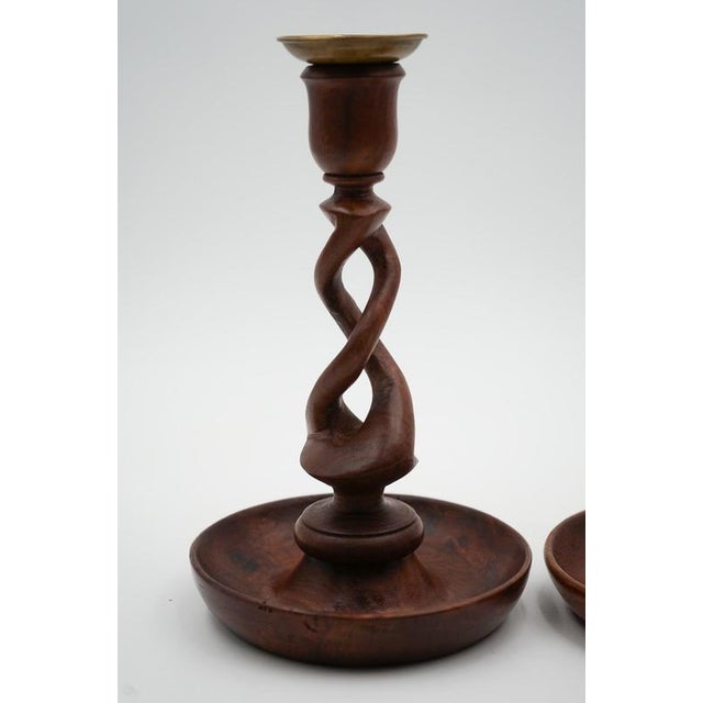 A charming pair of Early Victorian English oak barley twist candlesticks, beautifully turned with classic spiral stems and...
