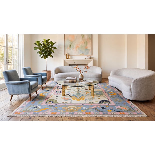 Elevate your living space with this exceptional hand-knotted modern Oushak-style area rug, crafted from premium hand-spun...