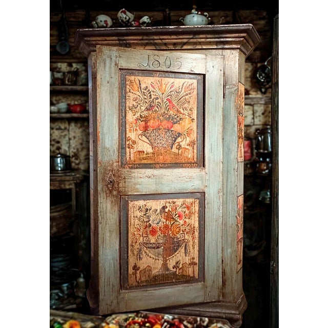 A soulful, heavy-timbered anchor for interiors that prioritize atmosphere over polish. This 1805 Tyrolean wardrobe is a...