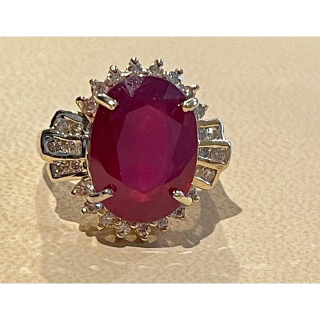 Oval 12 Carat Treated Ruby and 1 Carat Diamond 14 Karat Yellow Gold Ring For Sale - Image 10 of 18