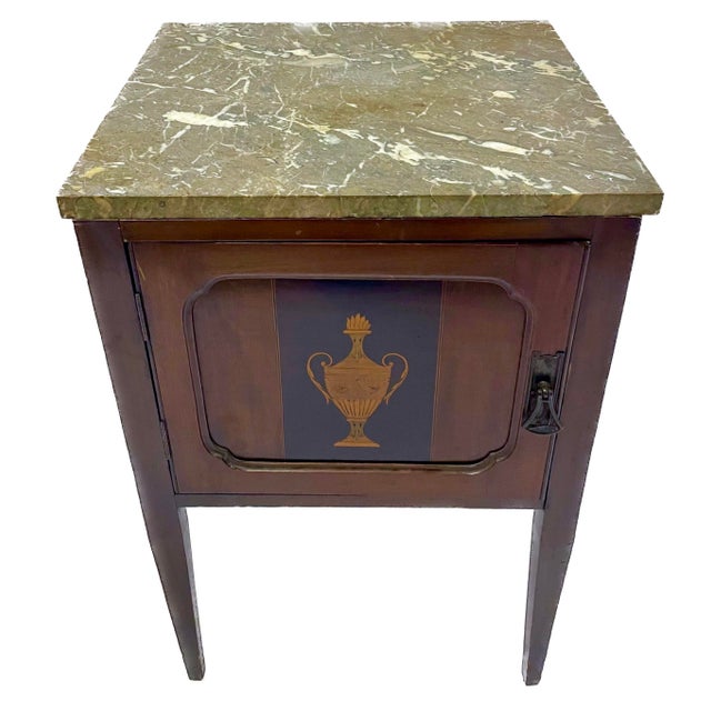 Antique inlaid urn marble top commode with door. Removable marble top. Inlaid urn design at the door center. No maker's...