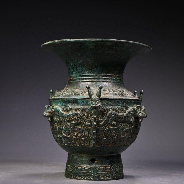 This is a striking vintage Chinese bronze vessel, crafted in the archaic style of ancient Shang and Zhou dynasty ritual...