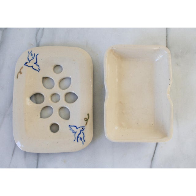 Vintage footed studio art pottery soap dish with dove motif. Signed and dated by artist on bottom. No chips or cracks.