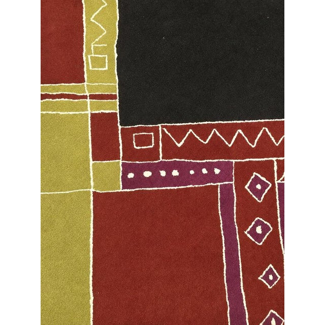 This original Tisca "Krumi" rug dates from the 1990s and is expertly hand-tufted from premium-quality wool, offering...