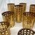 These are vintage Culver Cannella glassware pieces featuring an ornate 22-karat gold cane and basketweave overlay pattern....