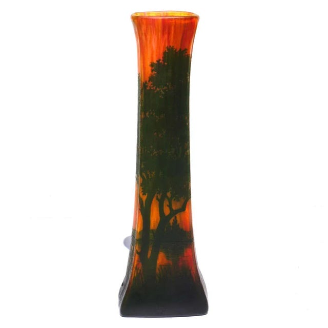 A warm scenic tall vase by Daum Freres from Nancy France circa 1900. The scene is a landscape with lake and green trees...