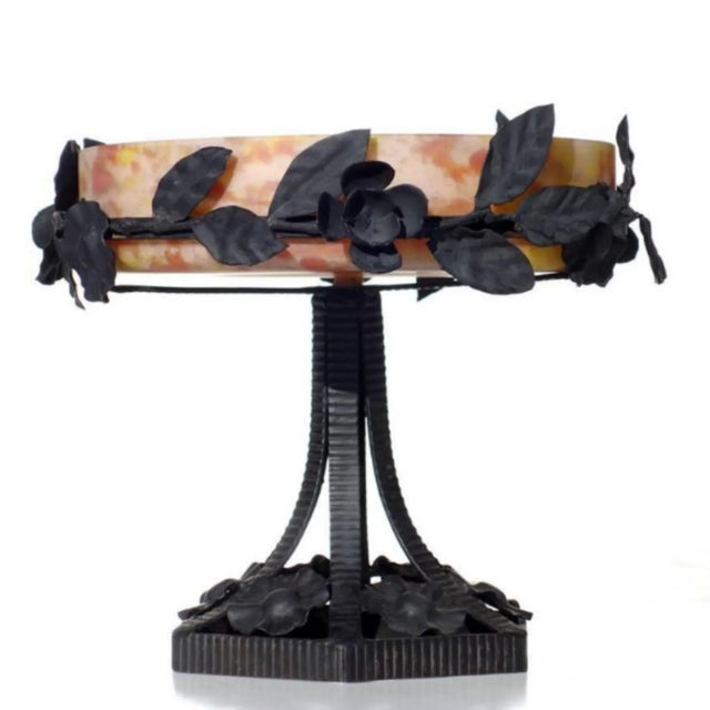 This Art Nouveau vase was produced by Lorrain and is signed.