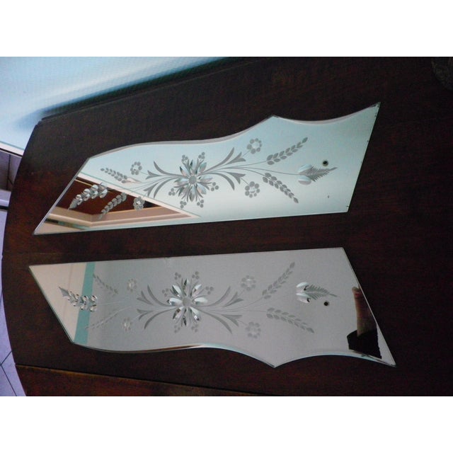 Set of two engraved, asymmetrical wall mirrors in the Venetian style. A high-end decorative element suitable for antique,...