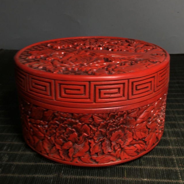 Discover the rich, tactile beauty of traditional Oriental lacquerware with this stunning Vintage Cinnabar Carved Lacquer...