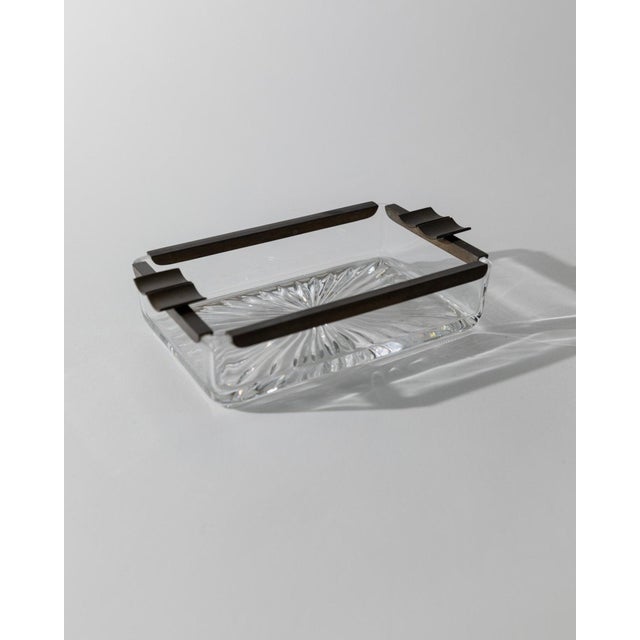 This rare vintage ashtray from the 1930s combines solid crystal glass with metal trim in a timeless Art Deco design. Its...