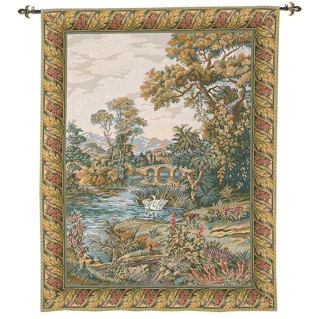 This rustic scene with a meandering river softly flowing through undulating countryside evokes the tranquil atmosphere of...