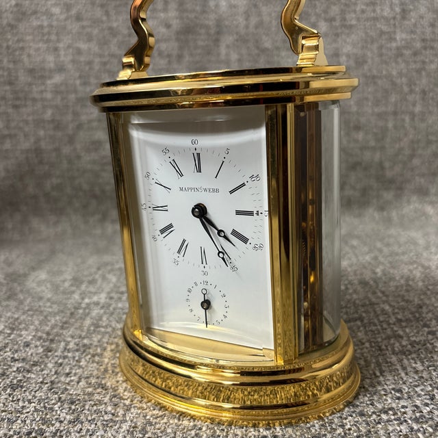 Beautiful Mappin & Webb Brass Carriage Clock. Designed with a see-through construction, this clock highlights the...