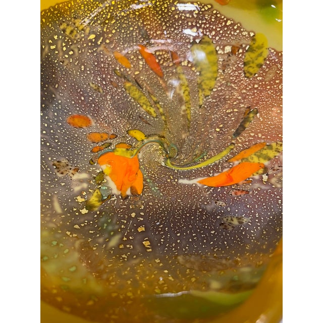 Beautiful vintage Murano style confetti decoration Italian art glass bowl. There is a rainbow of colors along with gold...