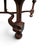 A tall, sculptural armchair in the Louis XIII tradition, pairing a high upholstered back and generous seat with gracefully...
