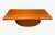 A striking Danish modern executive desk by Dyrlund, crafted in rich teak with the brand's signature soft, rounded edge...