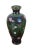 Antique Meiji era Japanese cloisonne bud vase in black with prominent pink, blue, and white flowers in and around tear...
