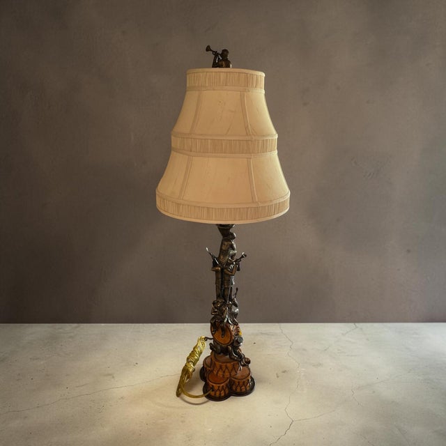 A rare and whimsical vintage Maitland-Smith table lamp featuring the celebrated “Monkey Band” motif. Handcrafted in the...