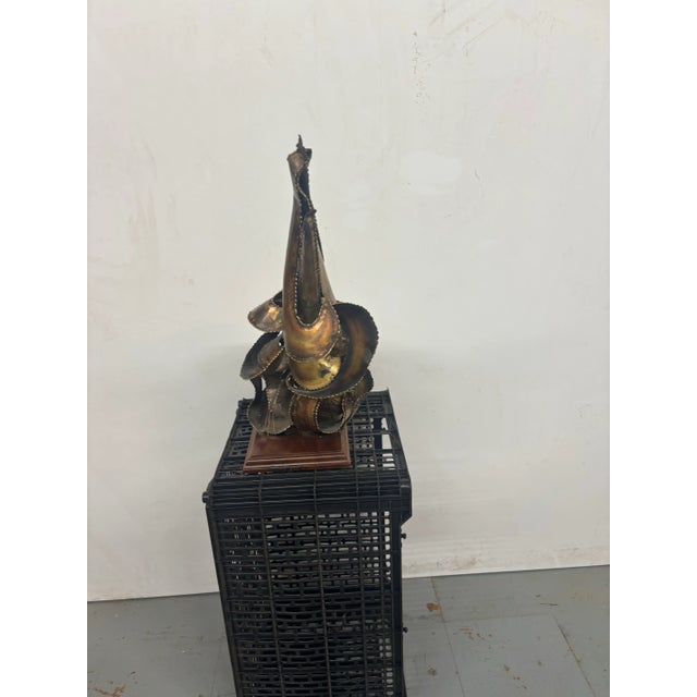 great decorative piece probably belongs to a large piece of brutalist brass piece