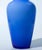 Elegant hand-blown art glass vase in a rich cobalt blue, featuring a smooth, minimalist surface and a beautifully balanced...