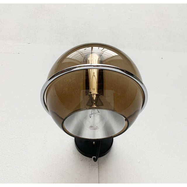 Rare Space Age Globe wall lights from Dutch manufacturer raak based on a design by Frank Ligtelijn from the late 50s. The...