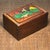 A handsome carved hardwood sliding drawer box, its surface inlaid with intricate bone work depicting green leaves,...