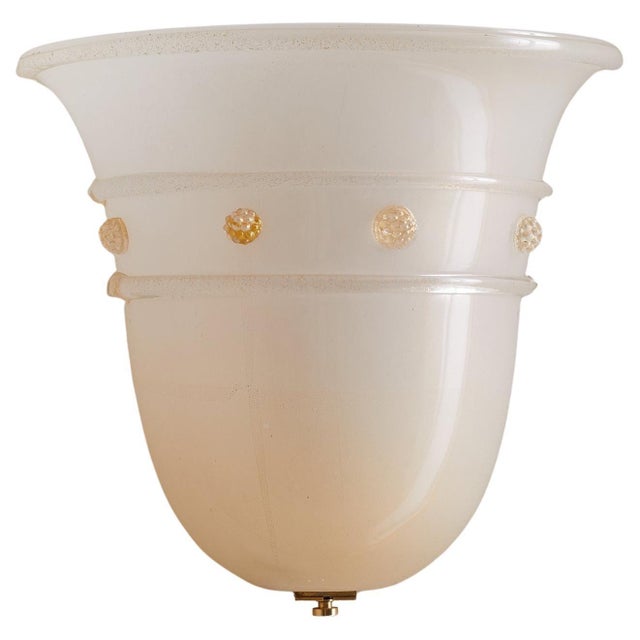 An Italian Murano glass sconce by the esteemed Barovier &amp; Toso atelier, model “Empire.” Hand-blown in milky glass with...