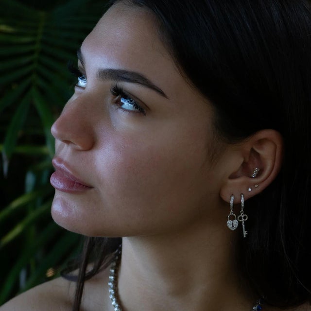 My Heart Is Yours Key & Heart Lock Gold Silver Diamond Earrings, a symbol of everlasting love and devotion. Crafted with...