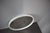Minimalist Mid-Century round mirror manufactured by APPL Spiegel in Germany during the 1960s. The piece features a rounded...