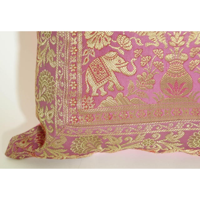 Decorative accent silk brocade throw pillow in fushia. Silk throw pillow made from brocade pink and gold metallic threads....