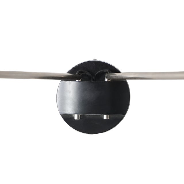 The David Weeks Studio Two Arm Sconce, Model #203, is a sculptural lighting fixture that blends artful asymmetry with...