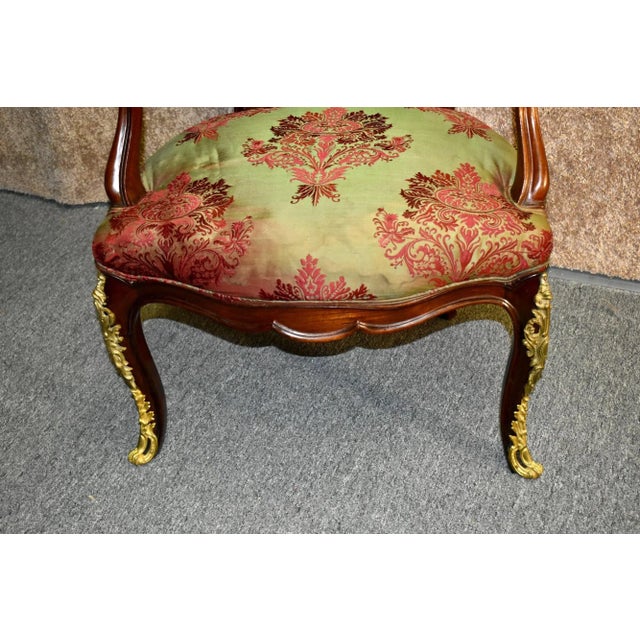 Vintage Ornate Arm Chair has an Italian Style. The Frame is Wood. Mahogany. The Fabric has a Shimmery Fabric with a Bold...