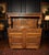 An impressive large solid oak sideboard dresser combining substantial craftsmanship with richly decorative carved...