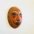 A wonderful vintage terra cotta pottery mask wall hanging. Natural unglazed finish with beautiful hand painted designs...