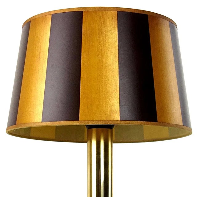 The base of this table lamp by German light specialist Doria Leuchten is made of smoked glass. It contains three bulbs,...
