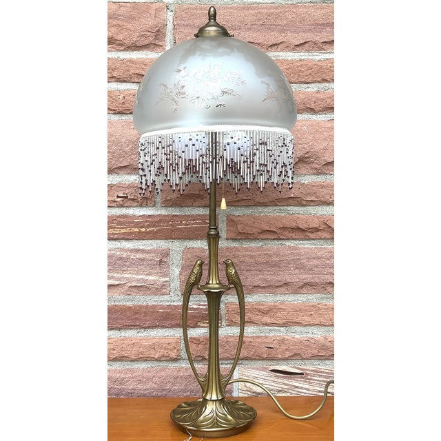 Brass 2-Light Table Lamp with Bird Figurine and Beaded Glass Shade, 1960s, in Very Good conditions. Designed 1960 to 1969...