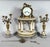 Louis XVI style mantel clock and floral candelabra. For Sale