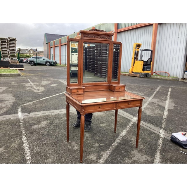 This is a classic Art Deco French dressing table, sometimes called a vanity. Made of French fruitwood, this vanity has...