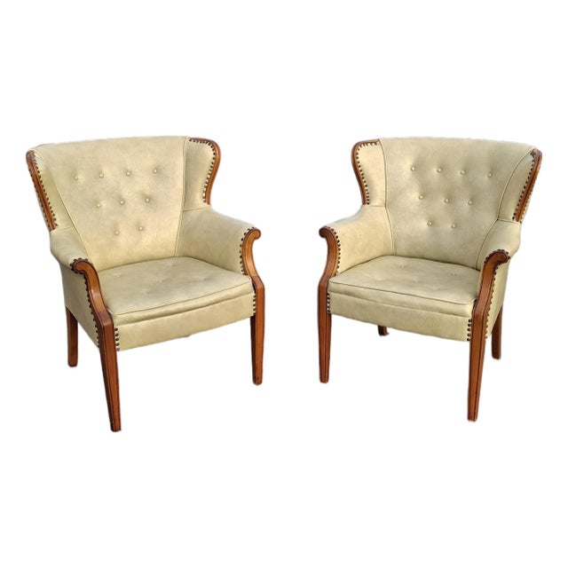 Pair Mid 20th Century Mahogany and Tufted Vinyl Upholstered Wingback Chairs For Sale