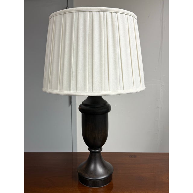 Design Plus Gallery presents an Urn Table Lamp from Pottery Barn. The urn-shaped body has an espresso brown finish,...