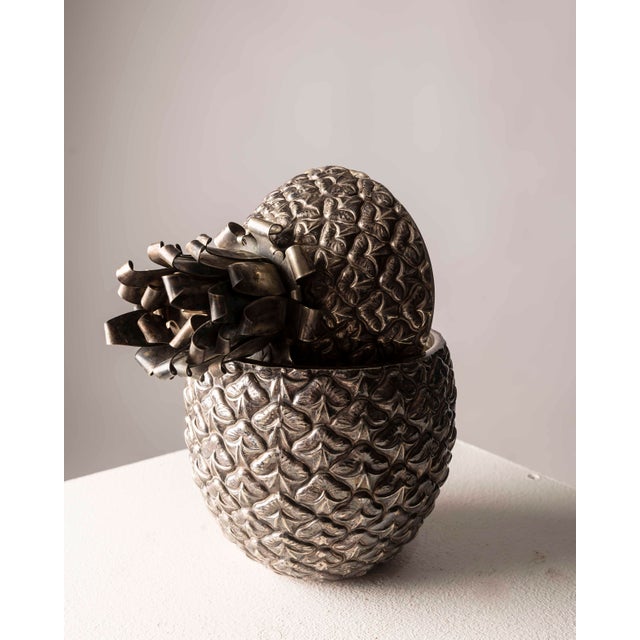 A decorative ice bucket in the shape of a pineapple, likely made in Italy or France during the 1970s. Crafted entirely of...