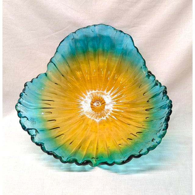 Bring a touch of Italian elegance to your home with this authentic Murano glass decorative bowl, beautifully hand blown by...