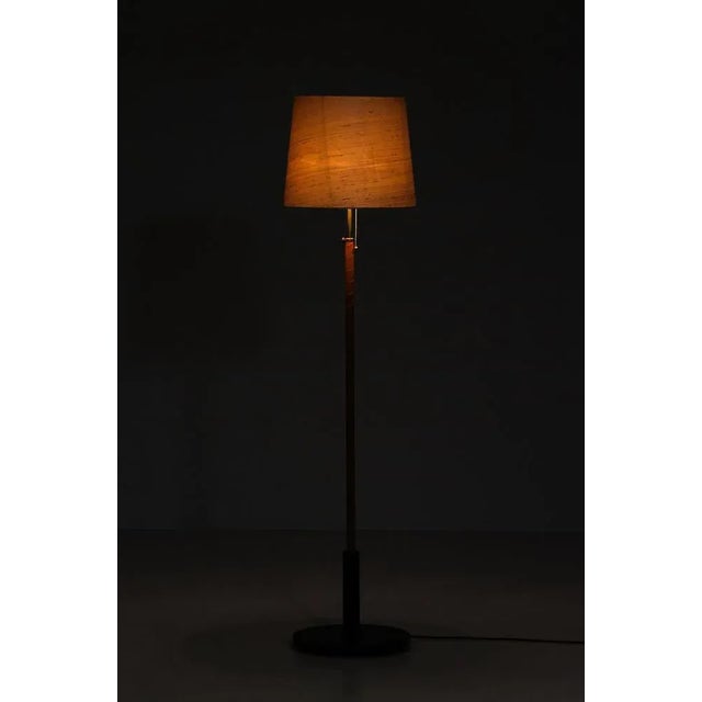 Swedish floor lamp with leather, brass and green marble base. Good condition, with signs of usage. Measures: Height 163...